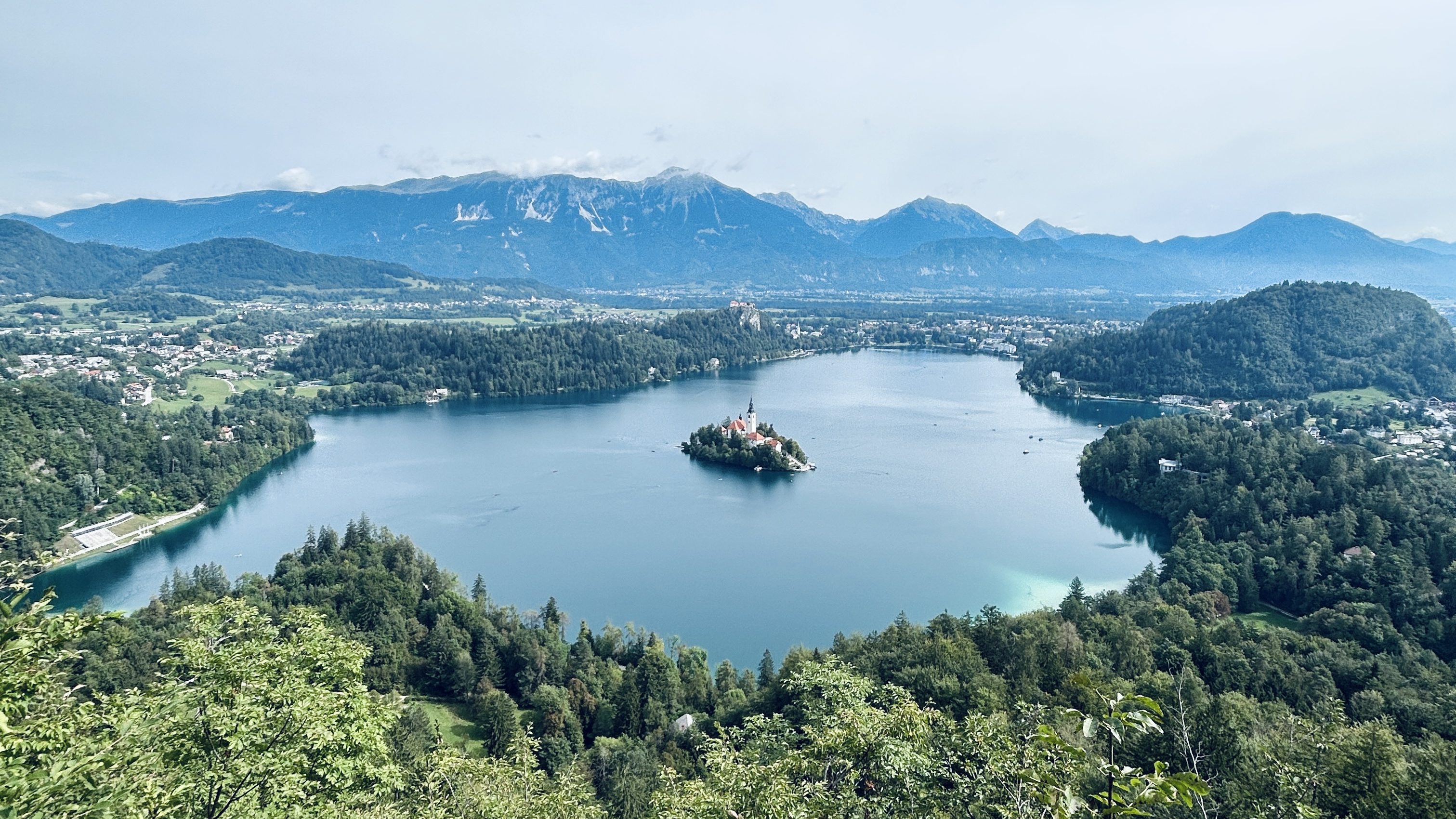 Lake Bled is renowned for its crystal-clear waters, charming island church, and medieval castle perched atop a rocky cliff
